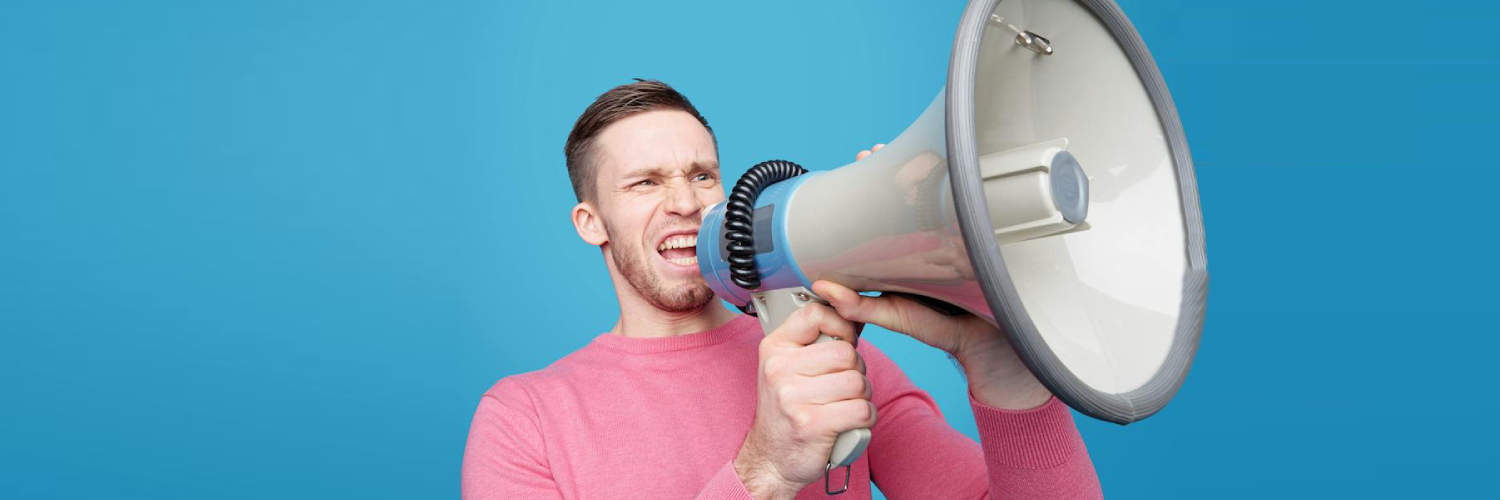 Man shouting through bull horn